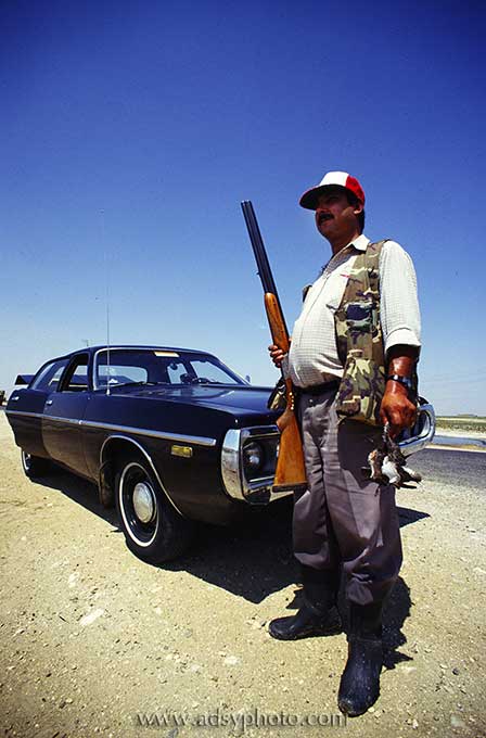 Adsy Bernart photographer travel photography syria, hunter, rifle, gun, car, driver