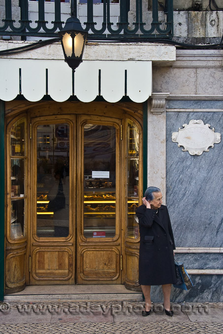 Adsy Bernart photographer travel photography Portugal Lisbon old lady portuguese in front of shop Baixa